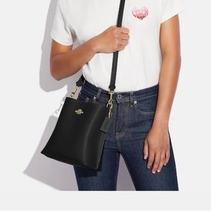Coach black leather bucket bag.
